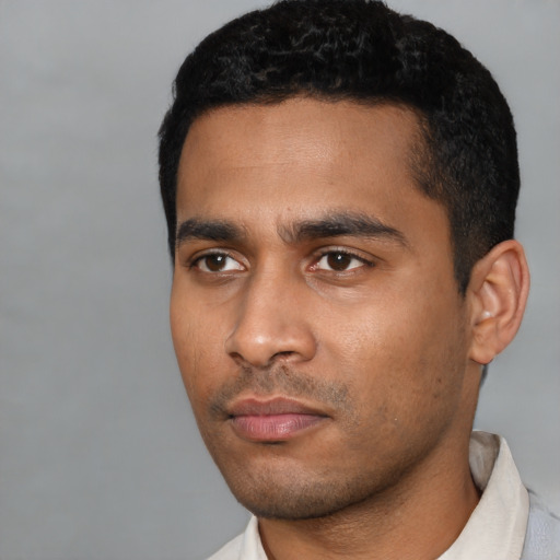 Neutral latino young-adult male with short  black hair and brown eyes