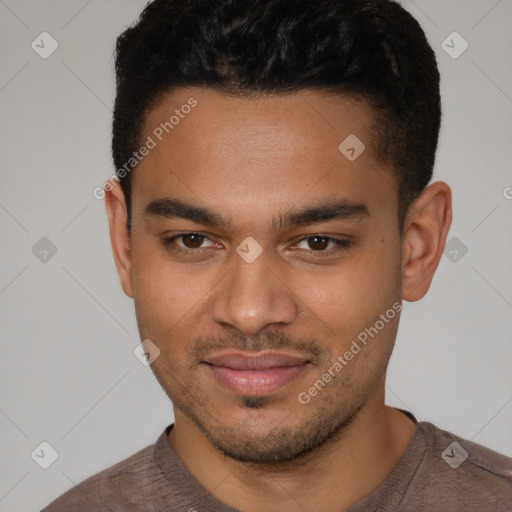 Joyful latino young-adult male with short  brown hair and brown eyes