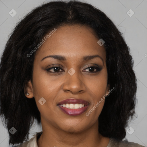 Joyful black young-adult female with long  brown hair and brown eyes