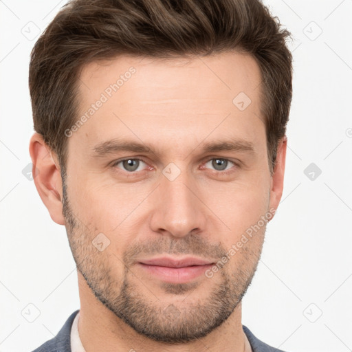 Joyful white young-adult male with short  brown hair and grey eyes