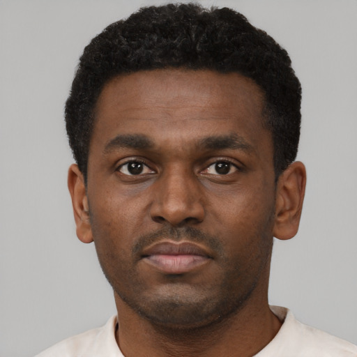 Neutral black young-adult male with short  black hair and brown eyes