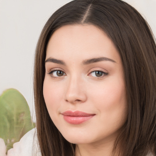 Neutral white young-adult female with long  brown hair and brown eyes