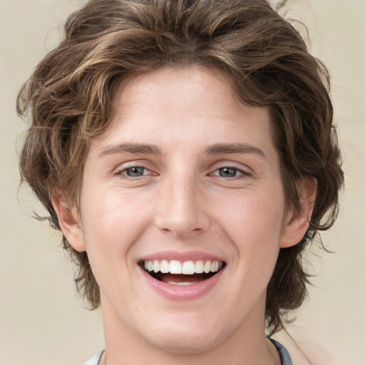 Joyful white young-adult female with medium  brown hair and green eyes