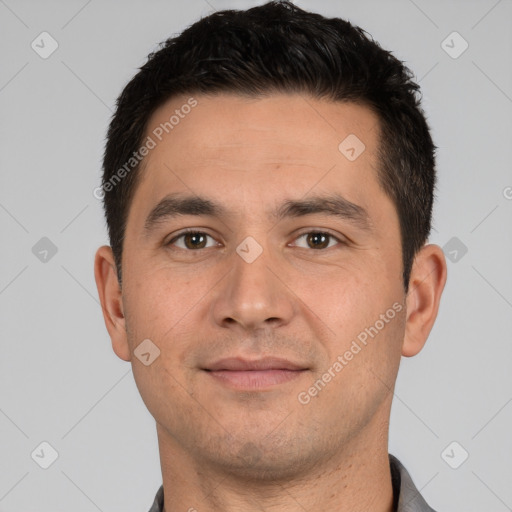 Joyful white young-adult male with short  black hair and brown eyes