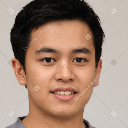 Joyful asian young-adult male with short  brown hair and brown eyes