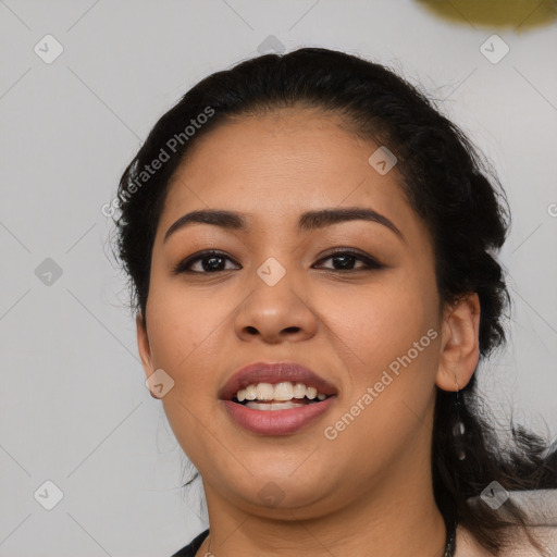 Joyful latino young-adult female with long  black hair and brown eyes