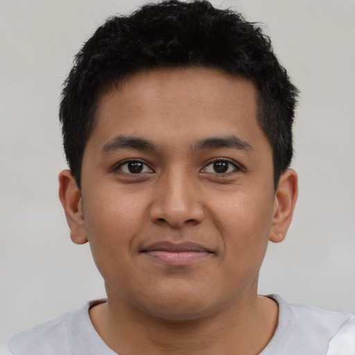 Joyful asian young-adult male with short  brown hair and brown eyes