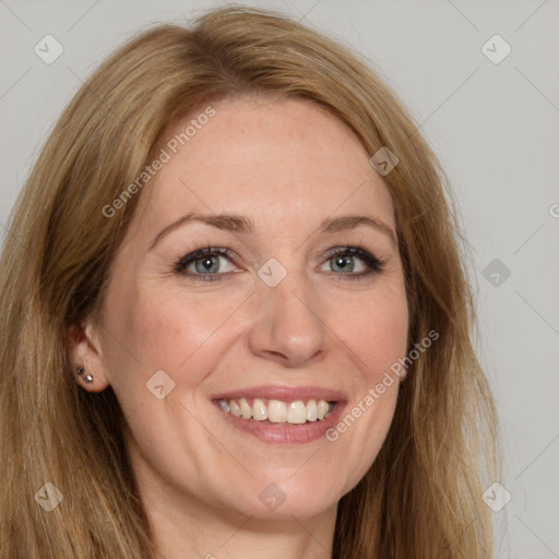 Joyful white adult female with long  brown hair and brown eyes