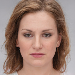 Joyful white young-adult female with medium  brown hair and blue eyes