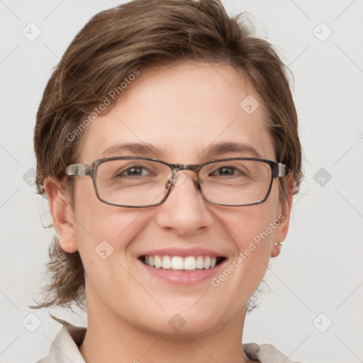 Joyful white adult female with medium  brown hair and grey eyes