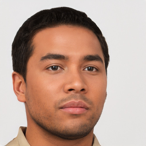 Neutral latino young-adult male with short  brown hair and brown eyes