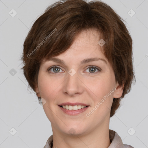 Joyful white young-adult female with short  brown hair and grey eyes