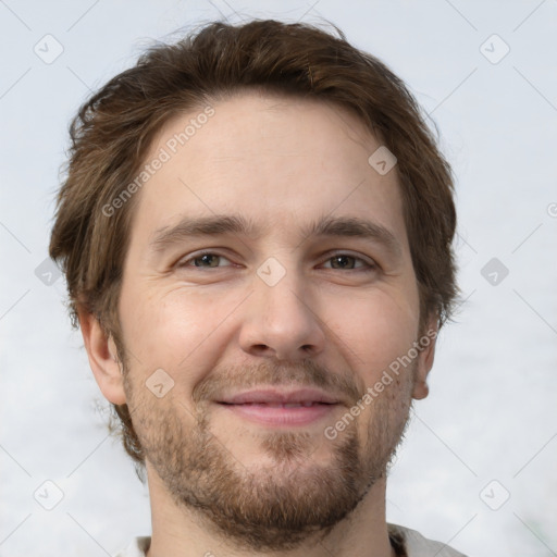 Joyful white adult male with short  brown hair and brown eyes