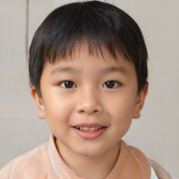 Joyful white child male with short  brown hair and brown eyes