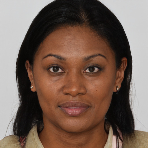 Joyful black young-adult female with medium  brown hair and brown eyes