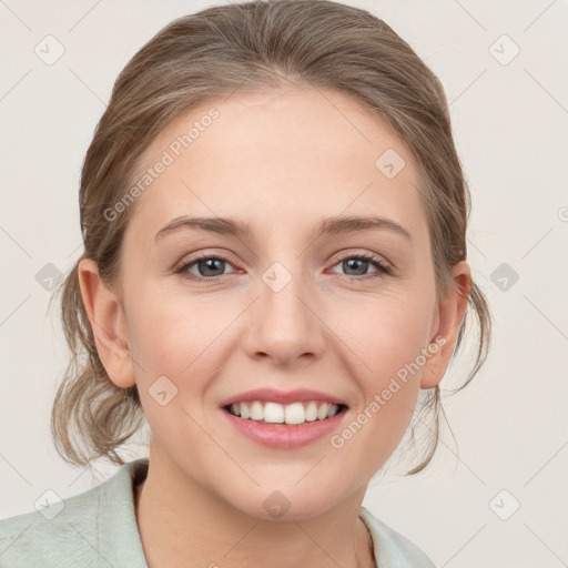 Joyful white young-adult female with medium  brown hair and blue eyes