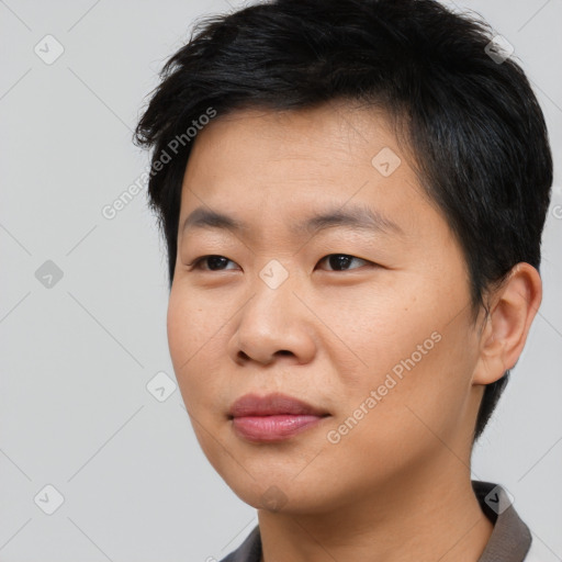 Joyful asian young-adult male with short  black hair and brown eyes