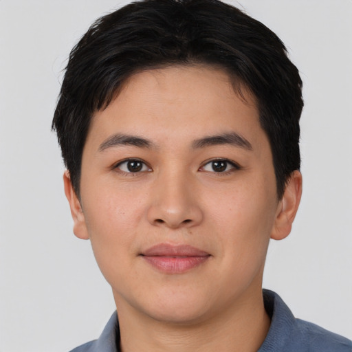 Joyful asian young-adult female with short  black hair and brown eyes