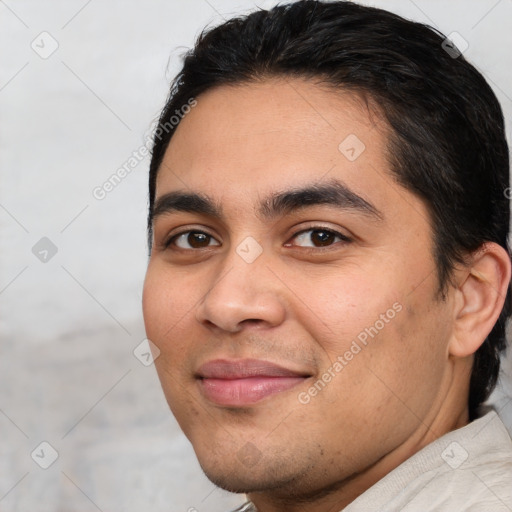 Joyful white young-adult male with short  black hair and brown eyes