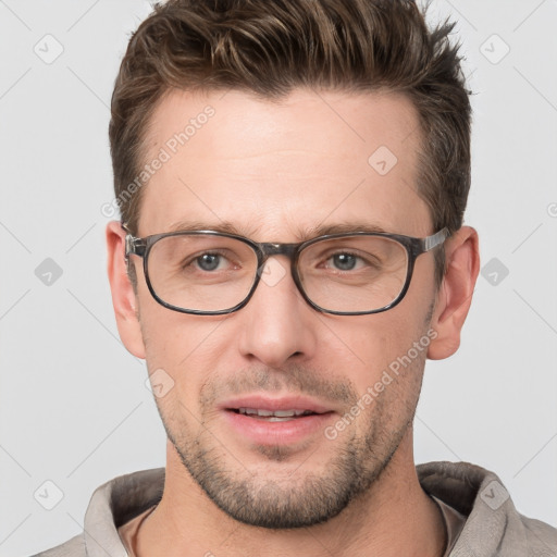 Joyful white adult male with short  brown hair and grey eyes