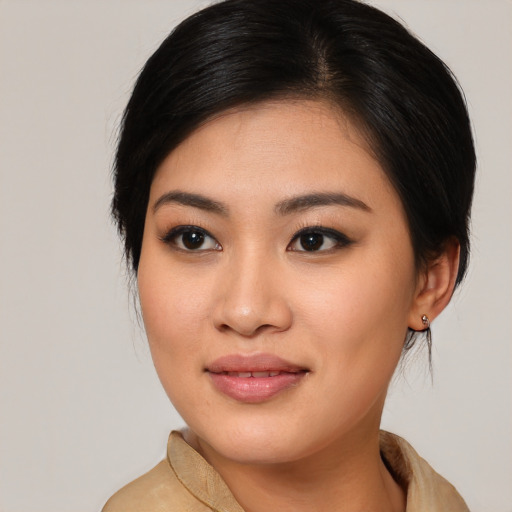 Joyful asian young-adult female with medium  brown hair and brown eyes
