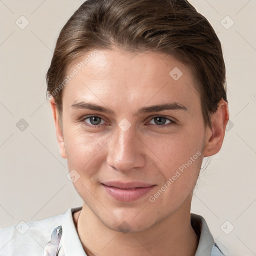 Joyful white young-adult female with short  brown hair and grey eyes