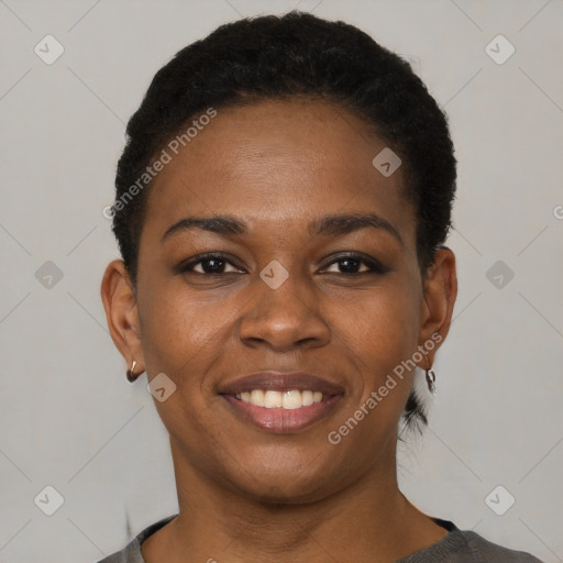 Joyful black young-adult female with short  black hair and brown eyes