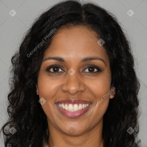 Joyful black young-adult female with long  brown hair and brown eyes