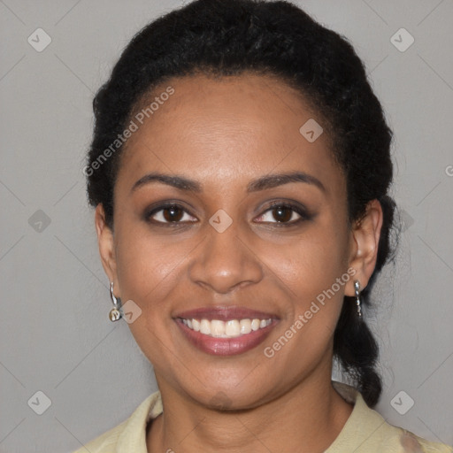 Joyful black young-adult female with short  black hair and brown eyes