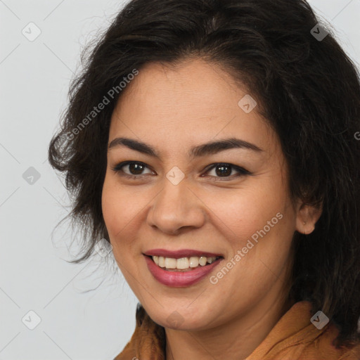 Joyful latino young-adult female with long  brown hair and brown eyes