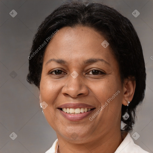 Joyful latino adult female with medium  brown hair and brown eyes