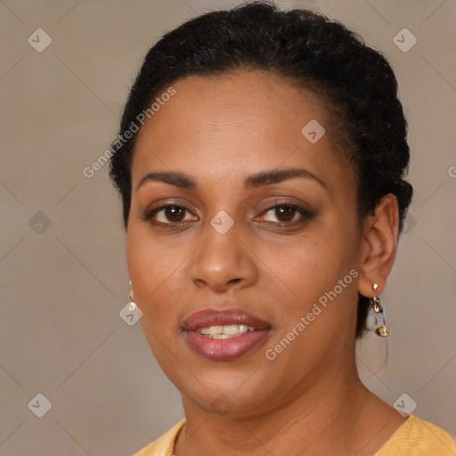 Joyful black young-adult female with long  brown hair and brown eyes