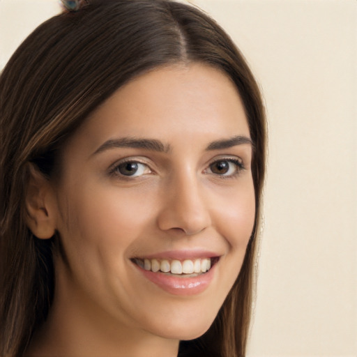 Joyful white young-adult female with long  brown hair and brown eyes