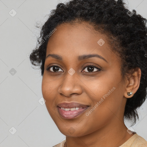 Joyful black young-adult female with long  brown hair and brown eyes