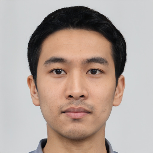 Neutral asian young-adult male with short  black hair and brown eyes