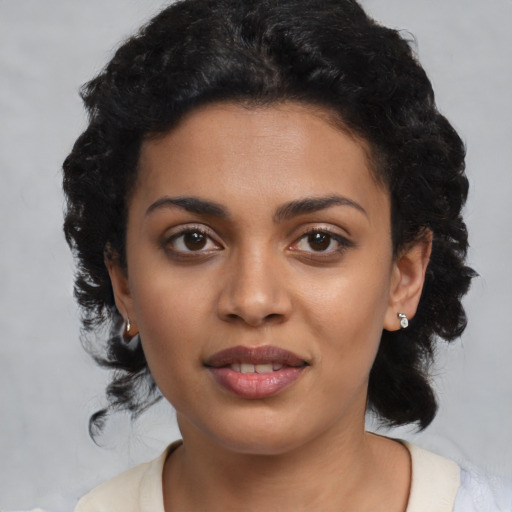 Joyful latino young-adult female with medium  black hair and brown eyes