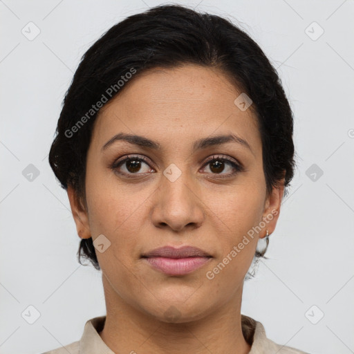 Joyful latino young-adult female with short  brown hair and brown eyes