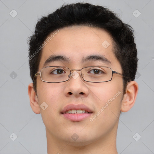 Joyful asian young-adult male with short  brown hair and brown eyes