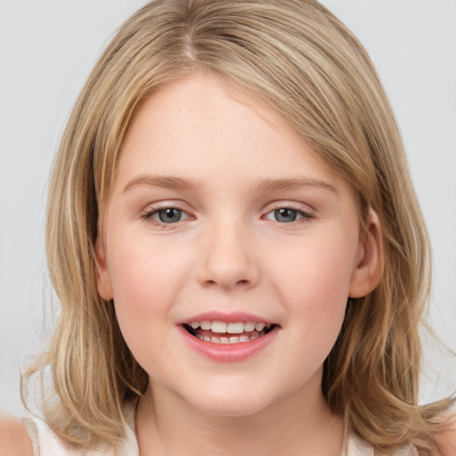 Joyful white child female with medium  brown hair and grey eyes