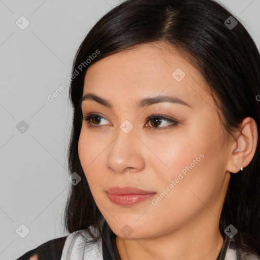 Neutral white young-adult female with long  brown hair and brown eyes