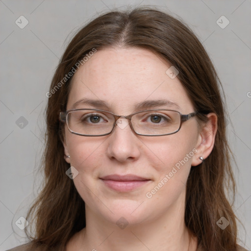 Joyful white young-adult female with long  brown hair and blue eyes