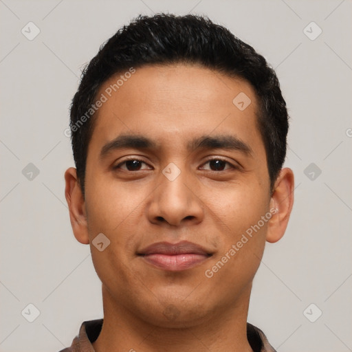 Joyful latino young-adult male with short  black hair and brown eyes