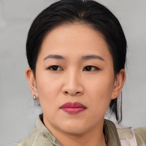 Neutral asian young-adult female with medium  black hair and brown eyes
