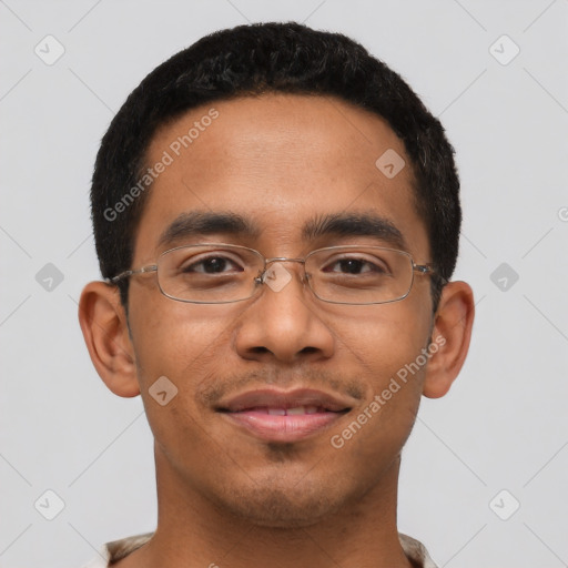 Joyful latino young-adult male with short  black hair and brown eyes