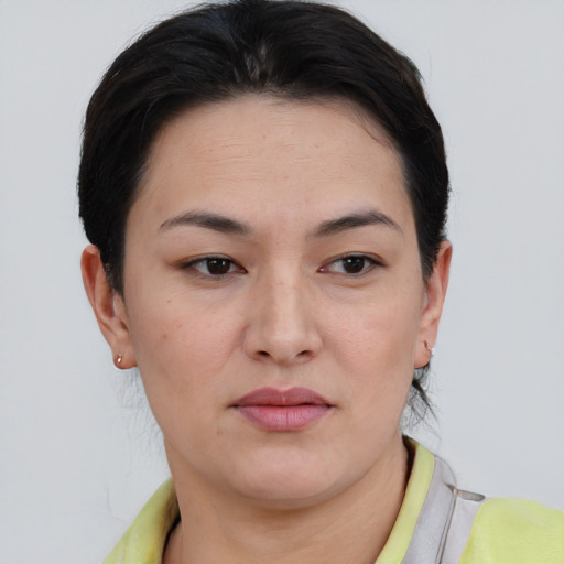 Joyful asian young-adult female with short  brown hair and brown eyes