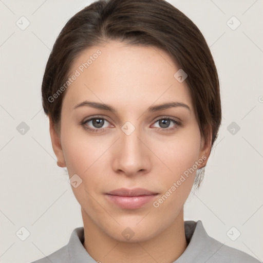 Neutral white young-adult female with short  brown hair and brown eyes