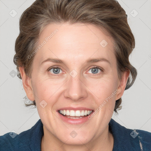 Joyful white adult female with medium  brown hair and blue eyes