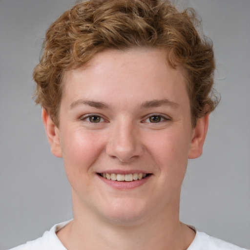 Joyful white young-adult female with short  brown hair and blue eyes