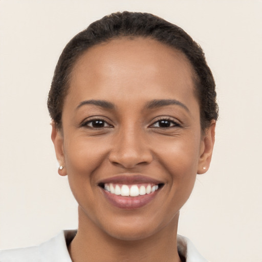 Joyful latino young-adult female with short  brown hair and brown eyes