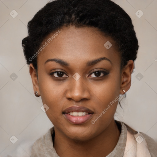 Joyful black young-adult female with short  black hair and brown eyes